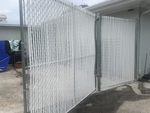 Photo of white privacy slat chain link fence