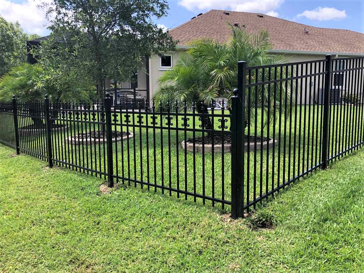 Photo of a custom black aluminum fence with differing heights